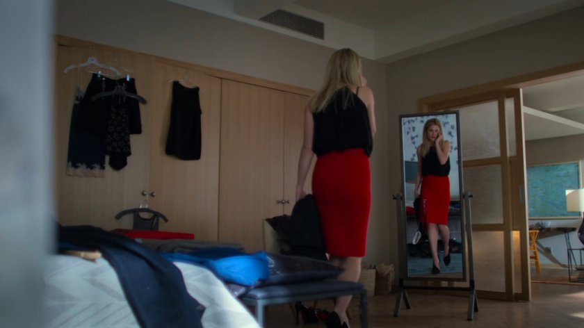 Trish on the phone in her bedroom.