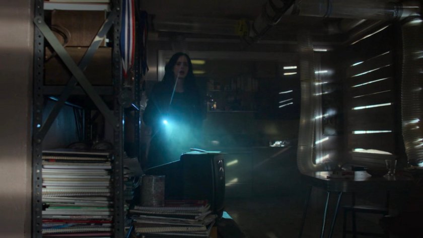 Jessica searching Robert Coleman's apartment.