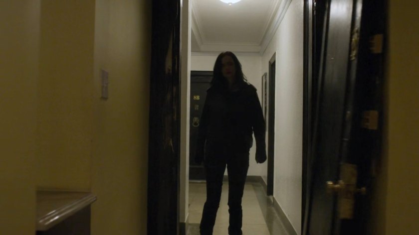 Jessica in the doorway of Dorothy Walker's apartment.