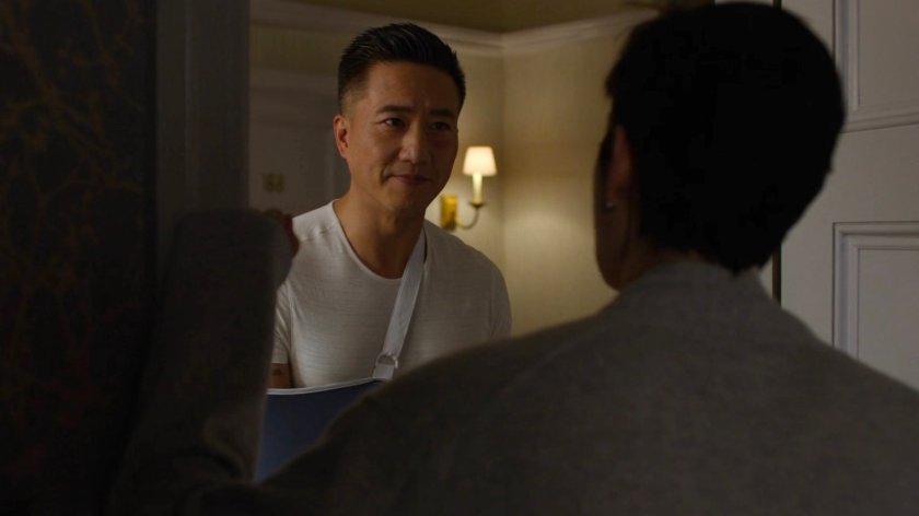 Jeri talking to Pryce at her apartment door.