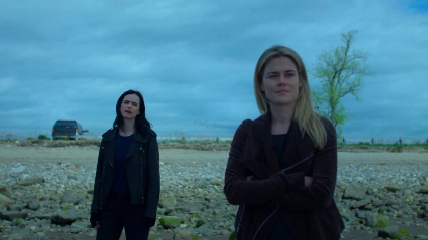 Jessica and Trish standing on a rocky beach.