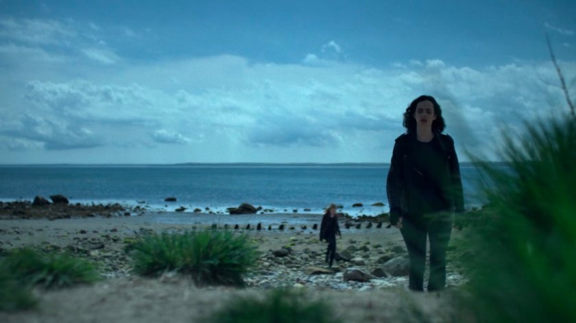 Jessica and Trish standing on a rocky beach.