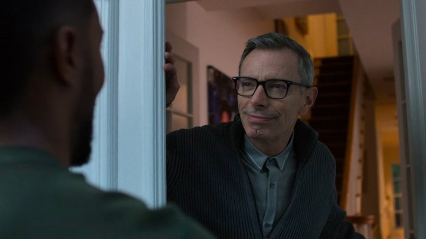 Malcolm and Eugene at the door of a brownstone.