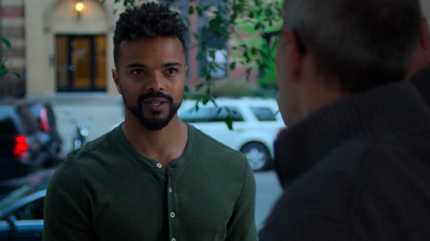 Malcolm and Eugene at the door of a brownstone.