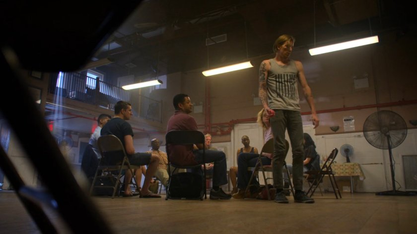 Gary stands and present his story at anger management group.