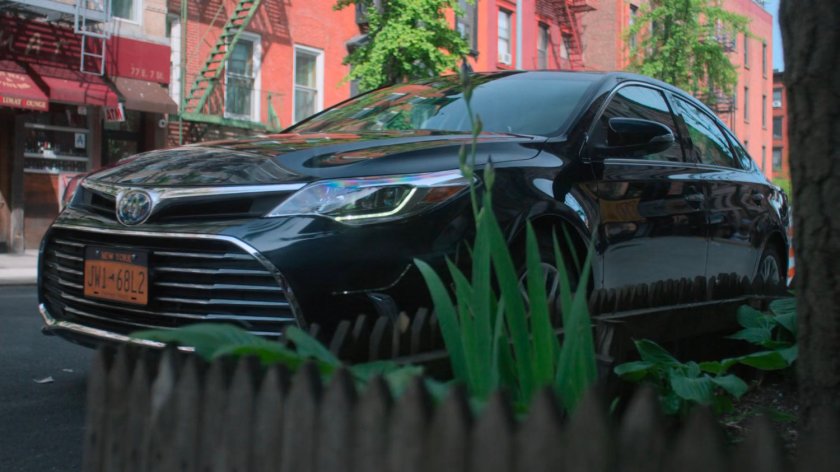 Trish's car outside Sally's wig shop.