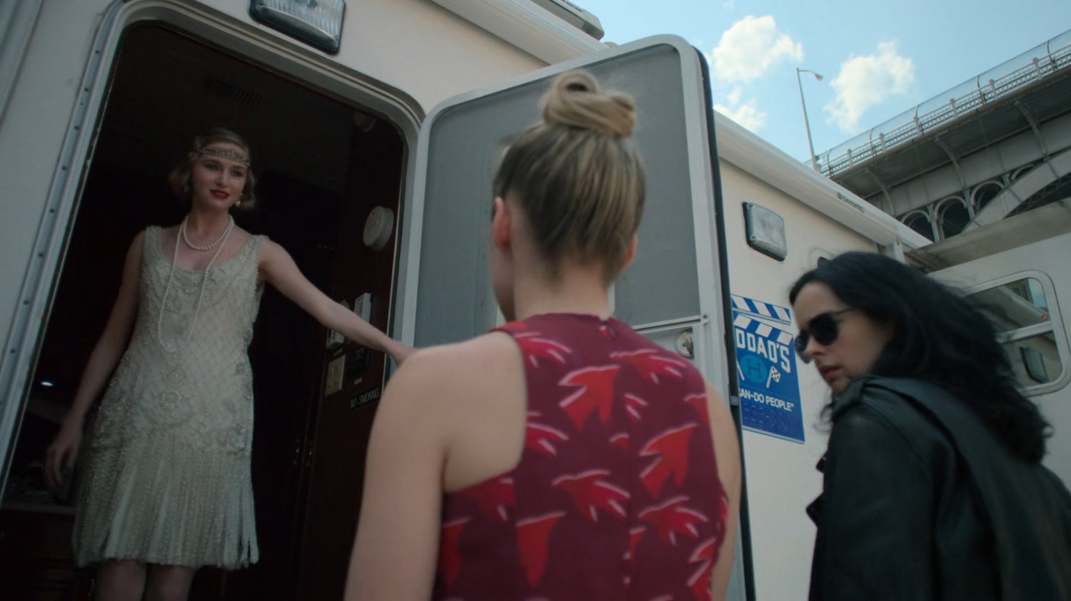 Jessica and Trish speaking to a young actress on a film set.