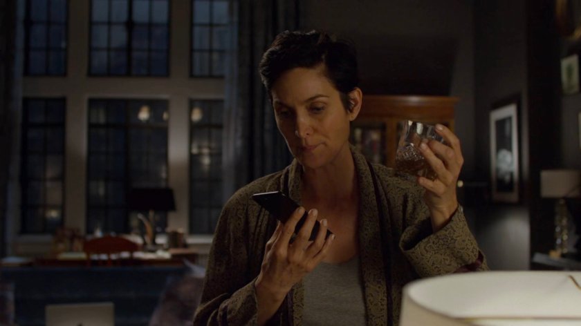 Jeri on the phone in her apartment.