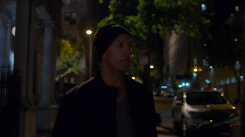 Nick outside Jessica's building at night.