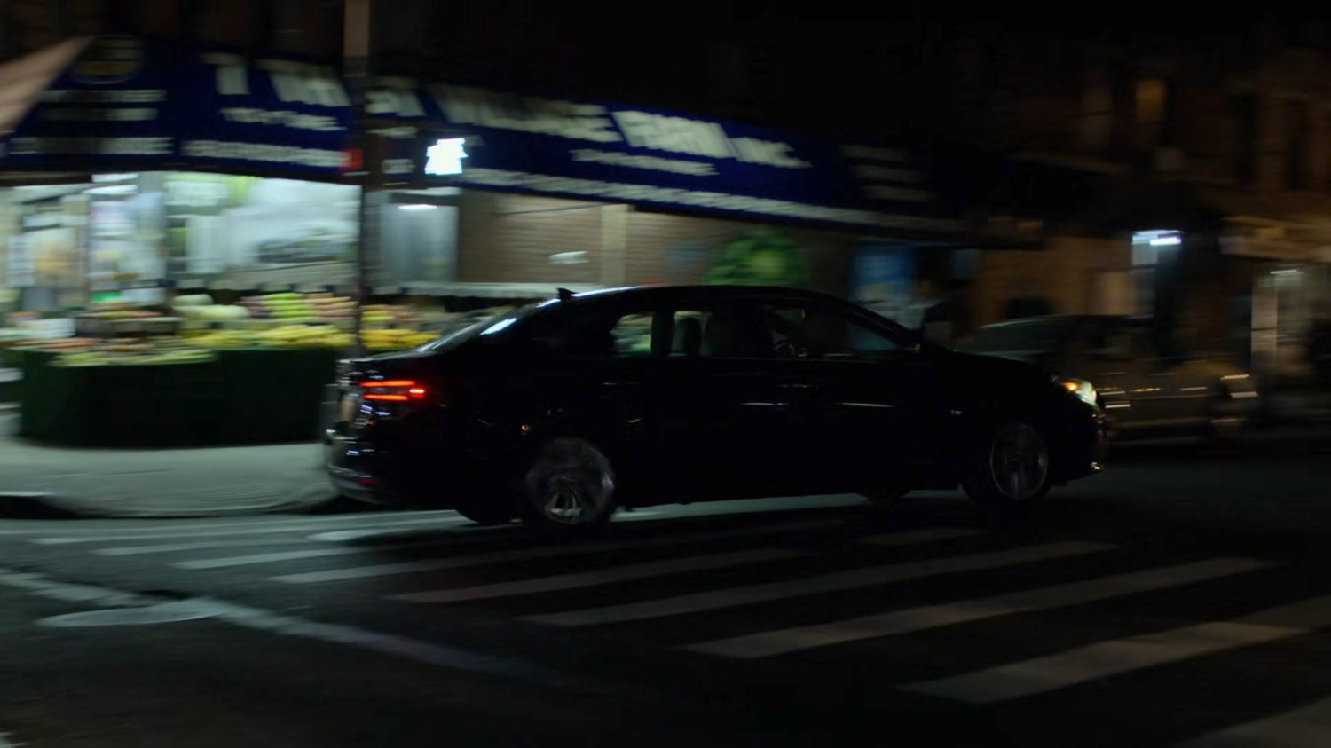 Trish's car taking a turn near Jessica's building.