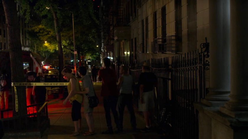 Onlookers gathered at a murder scene outside Jessica's building.