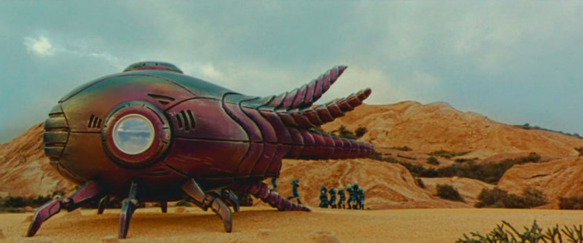 Aliens attacking Wonder Man on an alien planet.