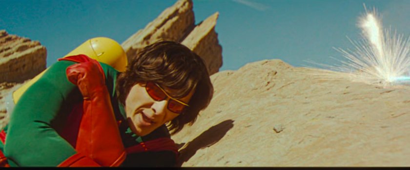 Wonder Man dodging a laser bolt on an alien planet.