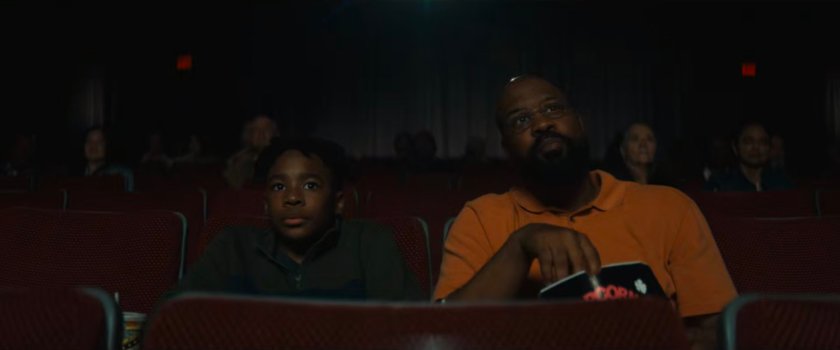 Young Simon and his father, Sanford, watching a Wonder Man movie in a theater,