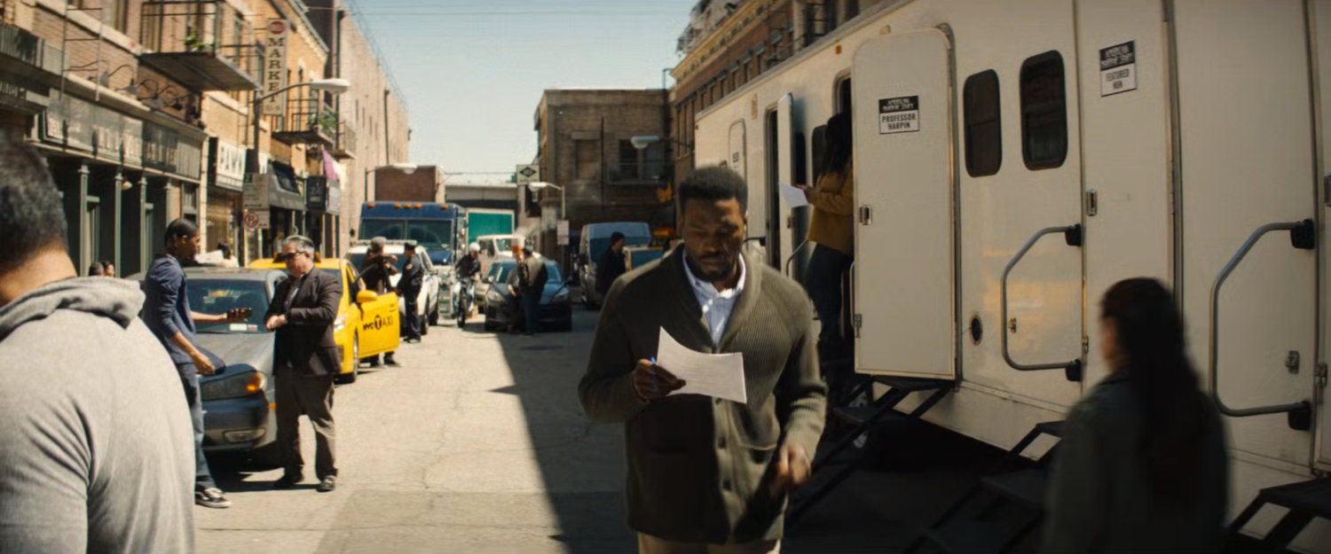 Simon Williams walking across the backlot of a Hollywood studio.