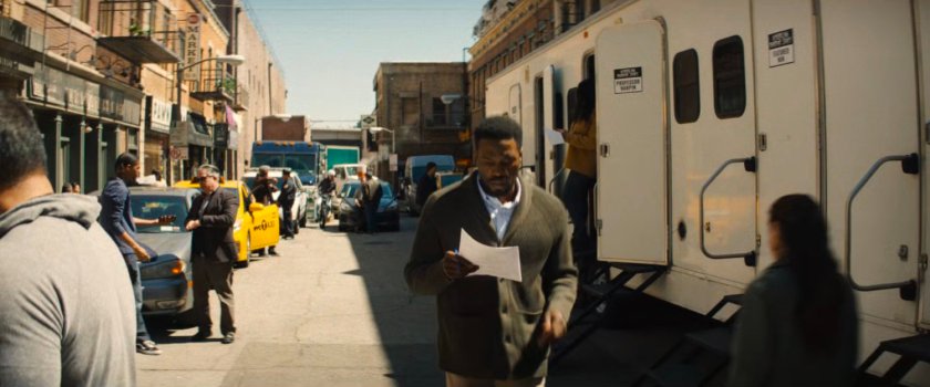 Simon Williams walking across the backlot of a Hollywood studio.