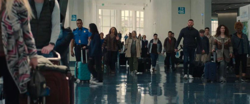 Trevor and passengers in the Los Angeles Airport terminal.