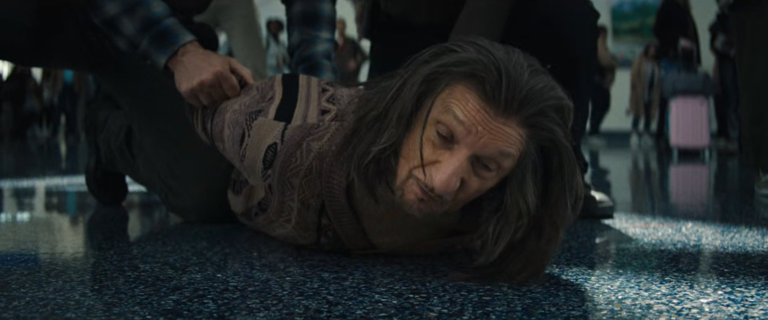 FBI Agents cover Trevor in the Los Angeles Airport terminal.