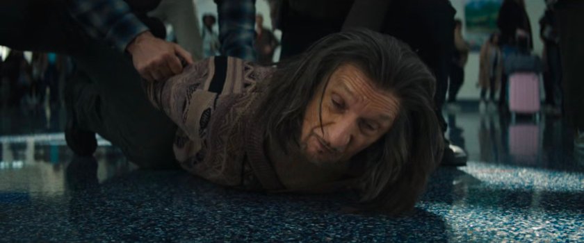 FBI Agents cover Trevor in the Los Angeles Airport terminal.