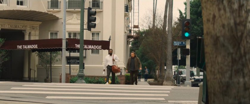 Trevor and Simon crossing the street outside Trevor's apartment, The Talmadge.