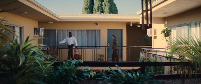 Trevor and Simon on the balcony outside Simon's apartment.