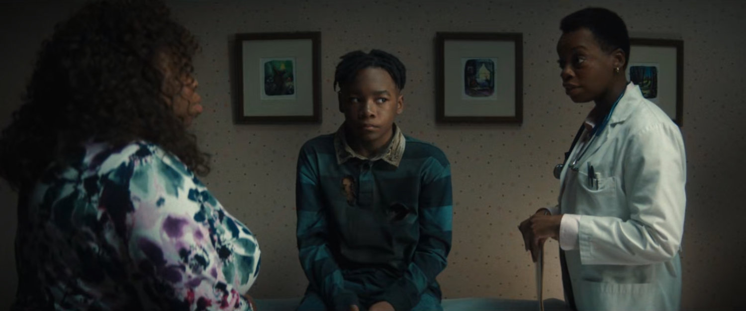 Young Simon with his mother and a Doctor.