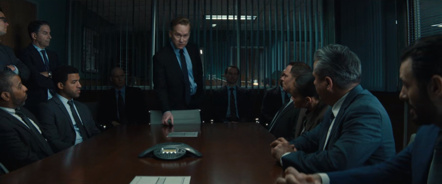 DODC Deputy Secretary Heyerdahl instructs agents in a conference room.