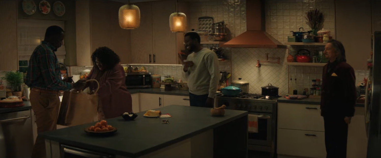 Eric, Martha, Simon, and Trevor inside the Williams family kitchen.