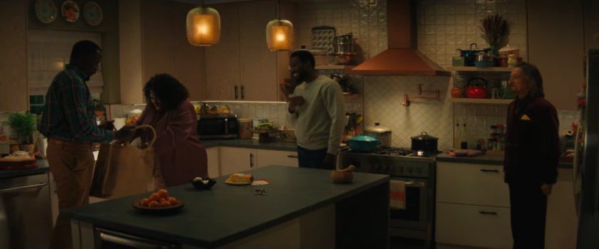 Eric, Martha, Simon, and Trevor inside the Williams family kitchen.