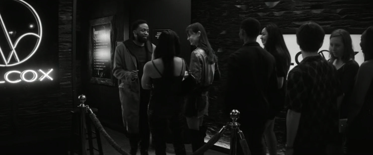 DeMarr Davis admitting people into the Wilcox Club.