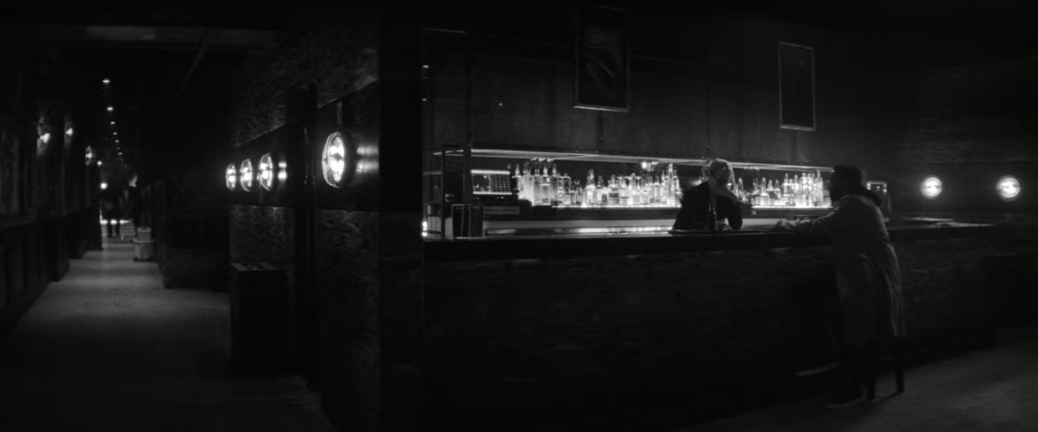 DeMarr and Bridget at the bar of the Wilcox Club.