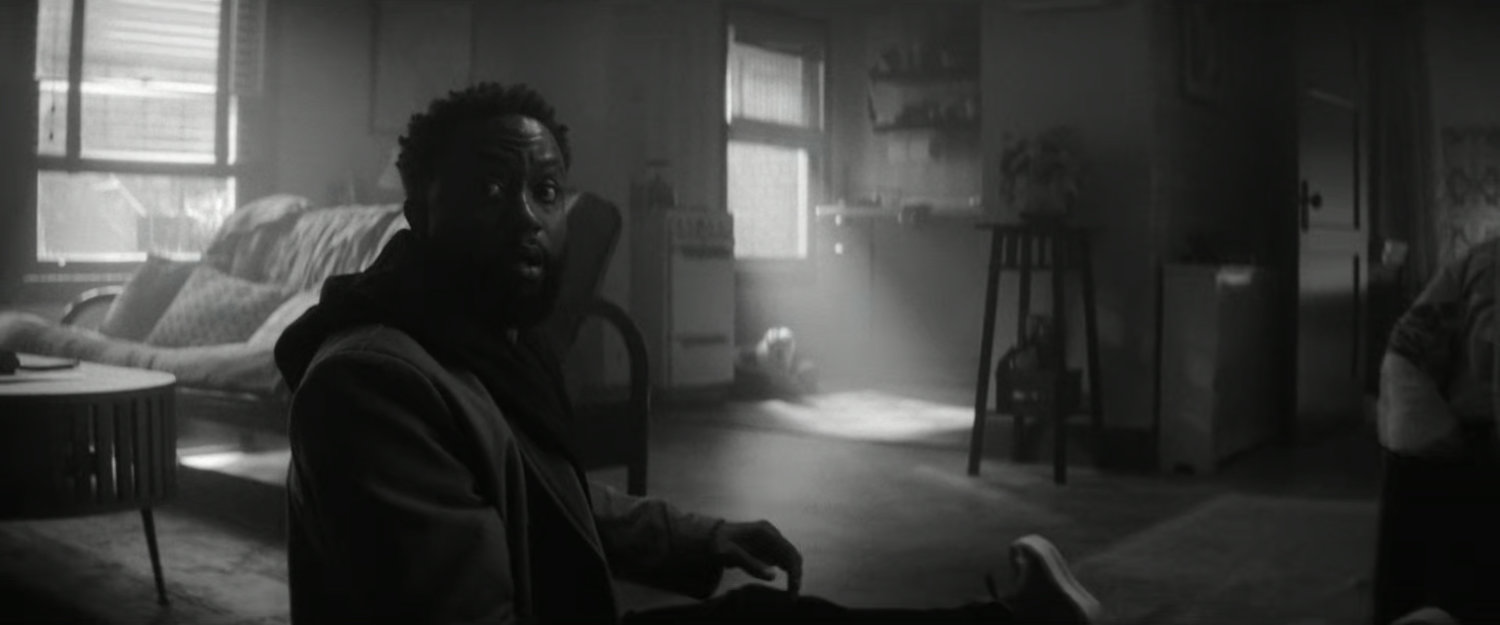 DeMarr awakening in his apartment.