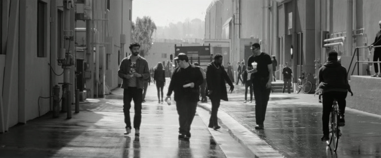 DeMarr and Josh Gad walking along a Hollywood backlot.
