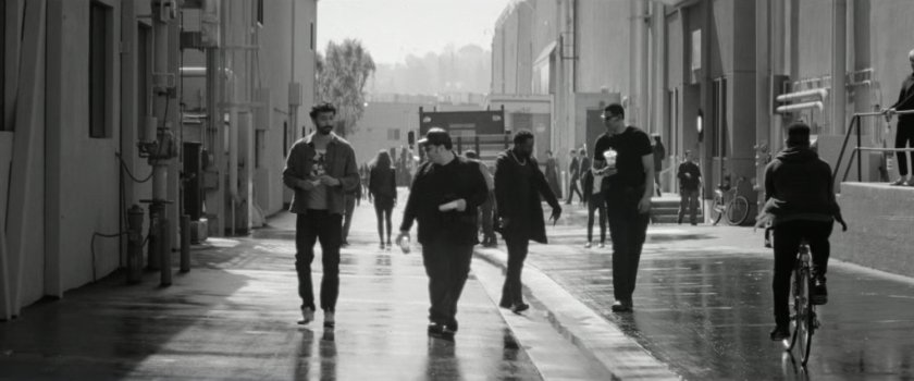 DeMarr and Josh Gad walking along a Hollywood backlot.