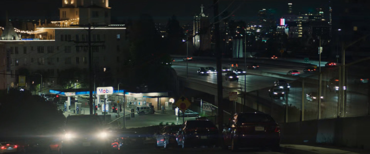 Nighttime view of Exxon station by Hollywood freeway.