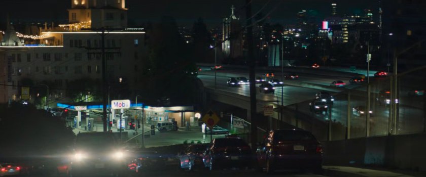 Nighttime view of Exxon station by Hollywood freeway.