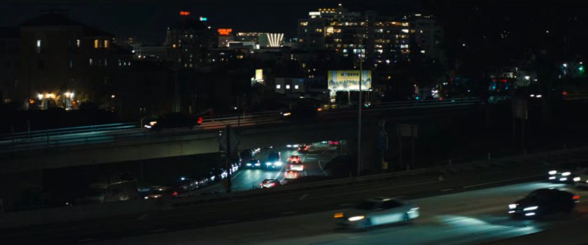 Nighttime view of Hollywood freeway and streets.