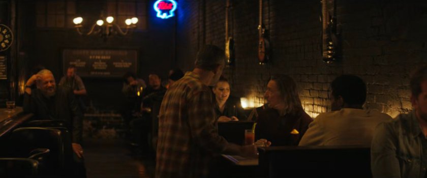 Waiter serving Trevor and Simon inside the Power House Bar.