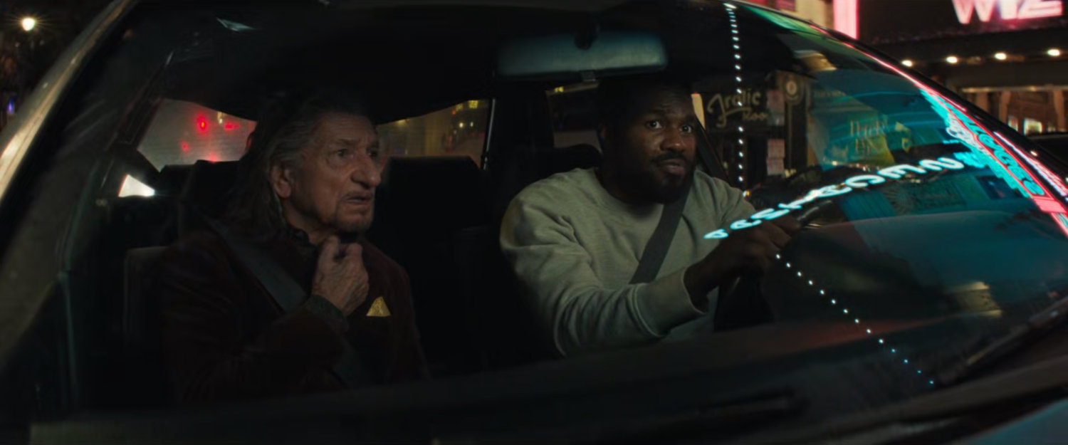 Trevor and Simon in the car driving through Hollywood looking for Jayden.