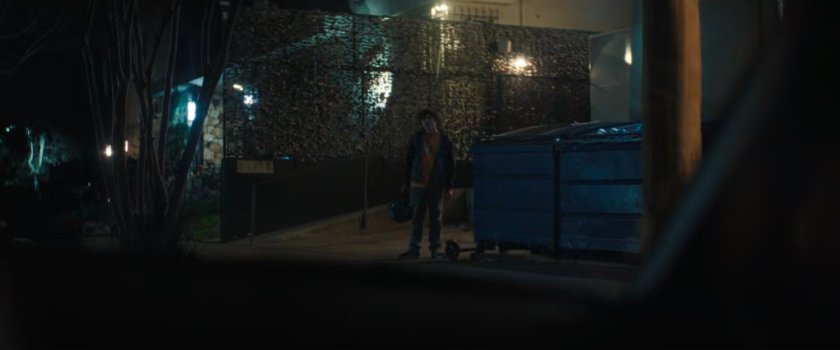 Jayden waiting outside a loading dock for Simon and Trevor.