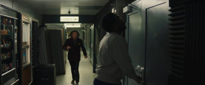 Simon and Trevor in the back hallway of a club.