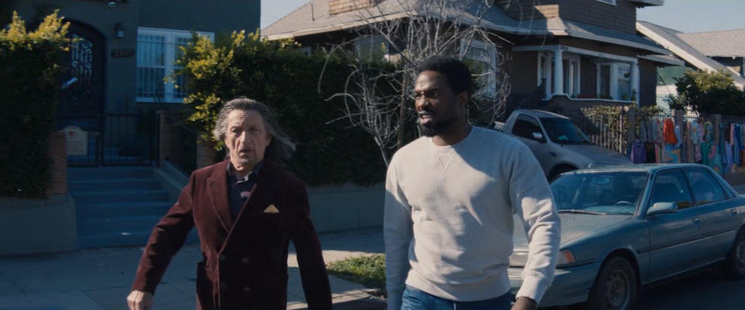 Trevor and Simon cross the street towards Esteban's house.