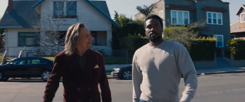 Trevor and Simon cross the street towards Esteban's house.