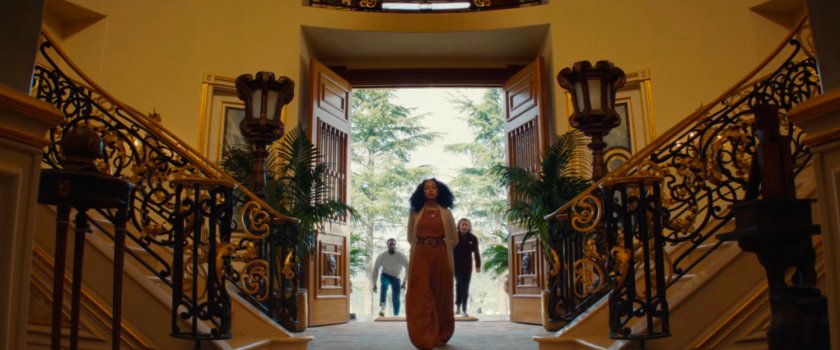 Melanie leads Trevor and Simon into Von Kovac's mansion.