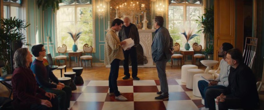 The actors reading lines in the game room in Von Kovac's mansion.