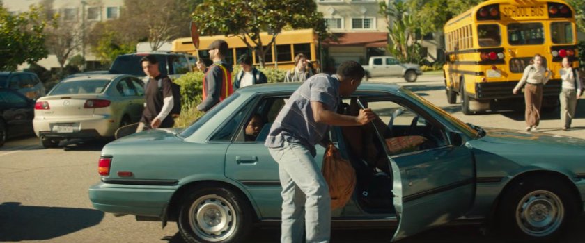 Eric getting out of Sanford's car at school.