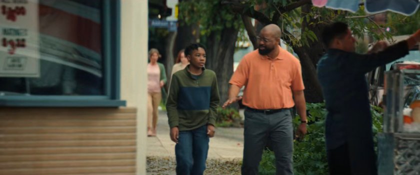 Sanford and young Simon on the sidewalk outside the Eagle Theater.