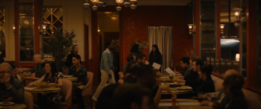 Trevor, Simon, and Janelle walk through a restaurant.