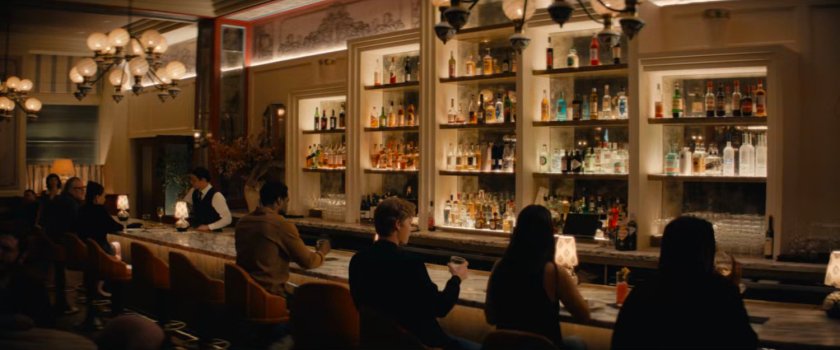 Simon sitting at fancy bar.