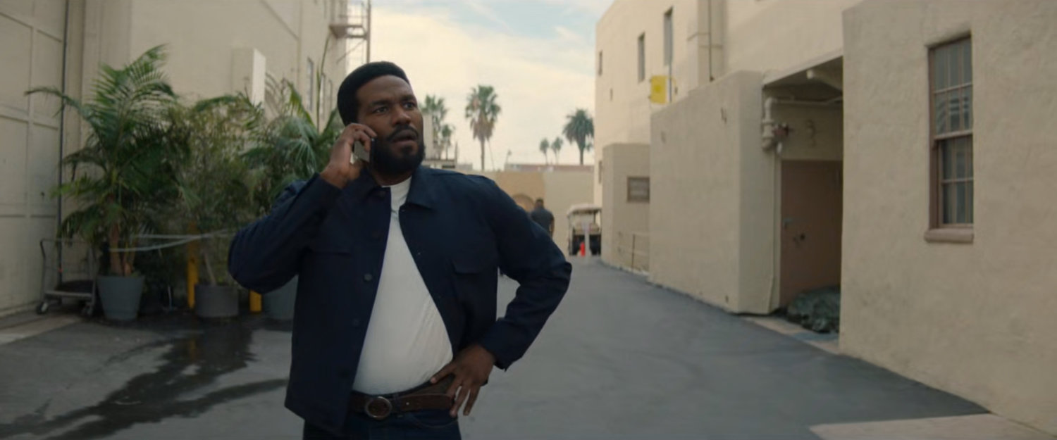 Simon on the phone on a Hollywood backlot.